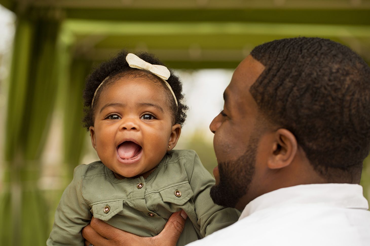 Man holding smiling baby